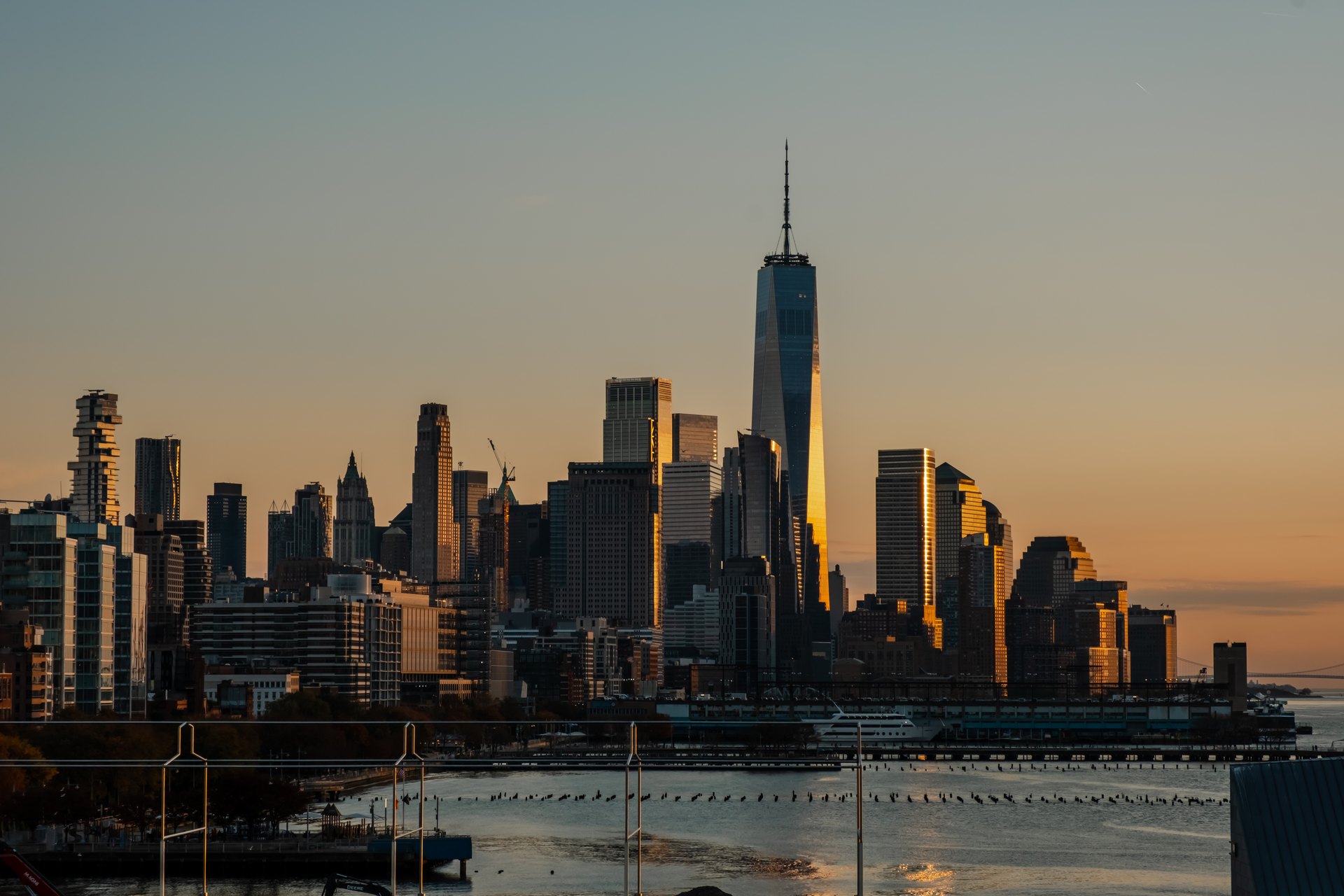 Lower Manhattan skyline at sunrise, One World Trade Center catching the light