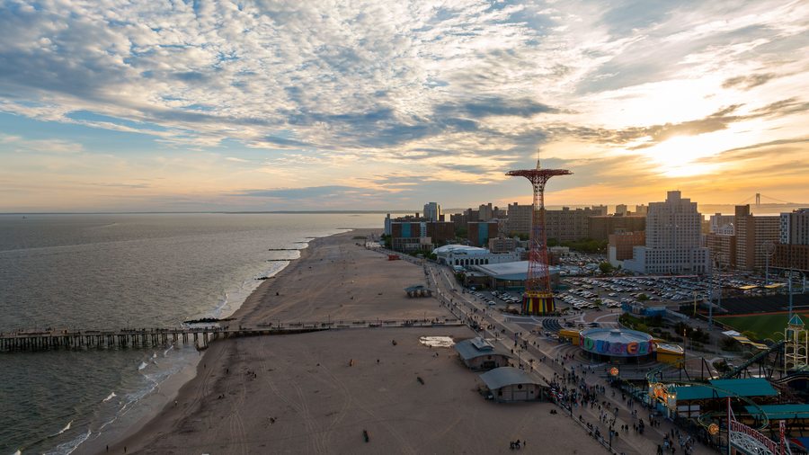 Coney Island beach and boardwalk at sunset