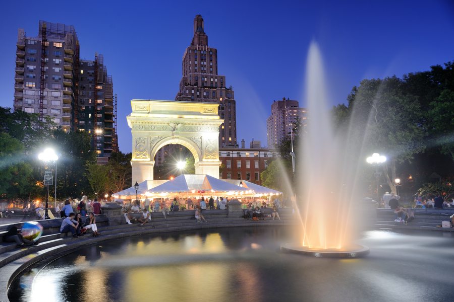 The marble arch and fountain in Washington Square Park at dusk