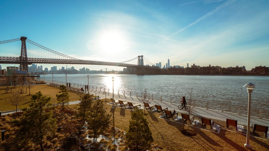 The Williamsburg waterfront under the bridge with the Manhattan skyline
